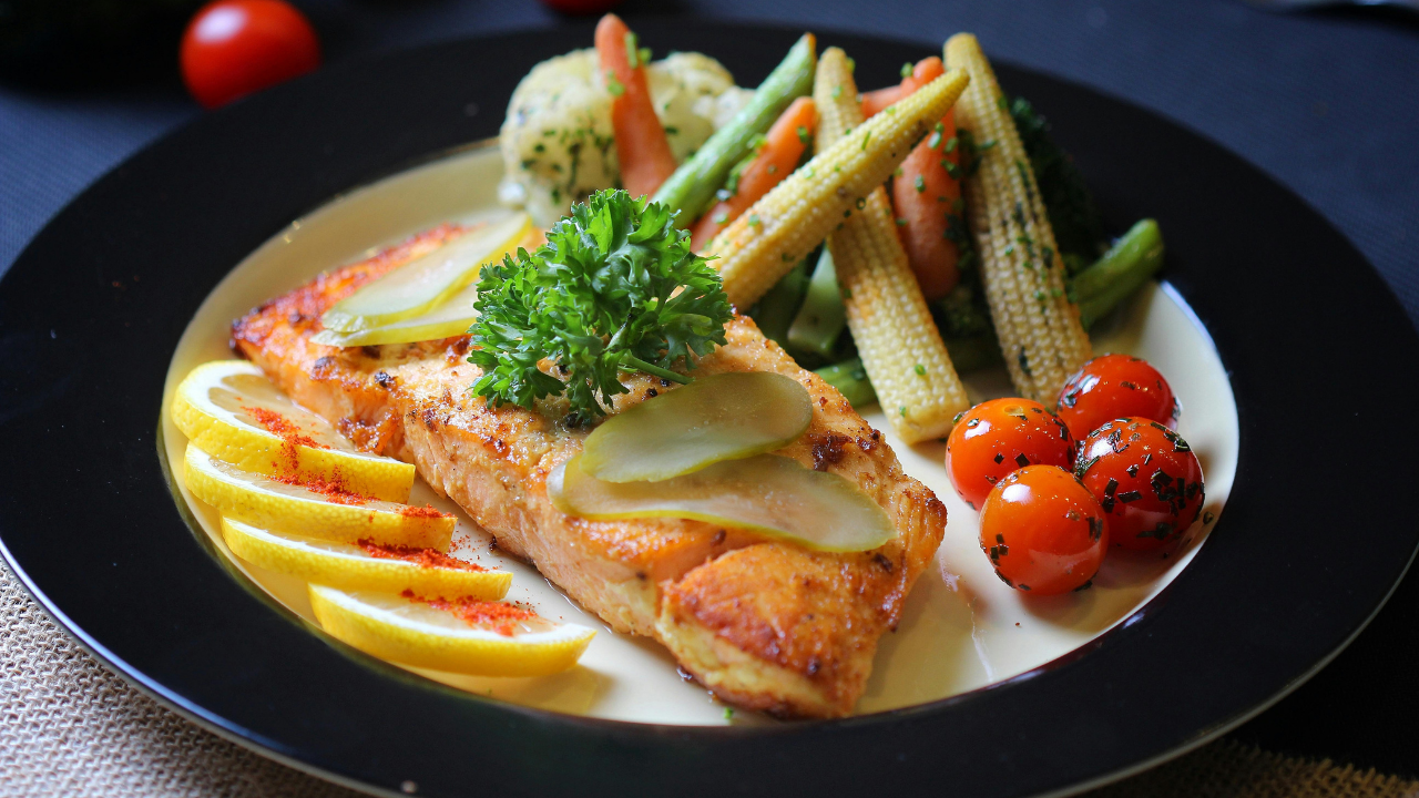 13. Salmon and fresh vegetables with creamy white wine sauce