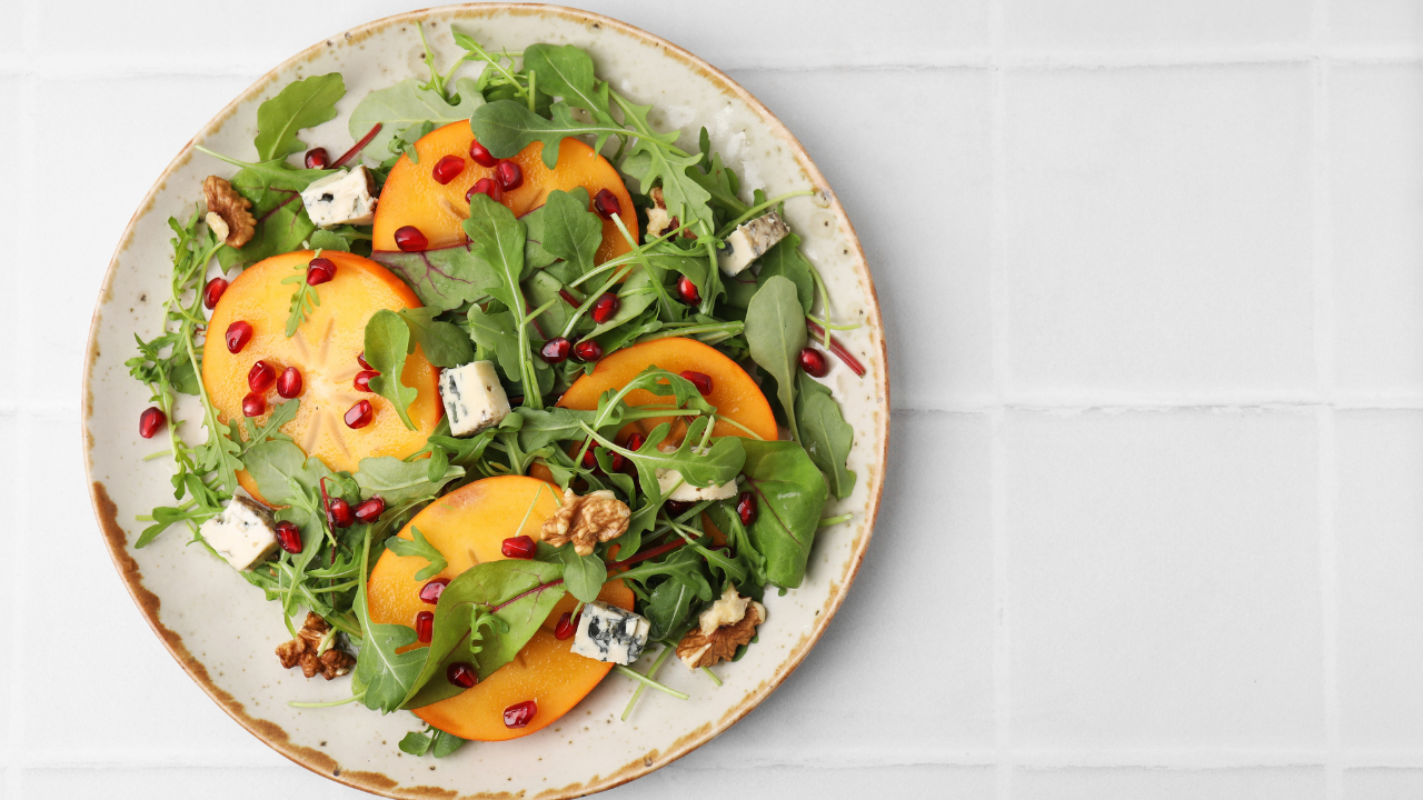 1. Persimmon and Pomegranate Salad with Burrata and Pistachio Dukkah