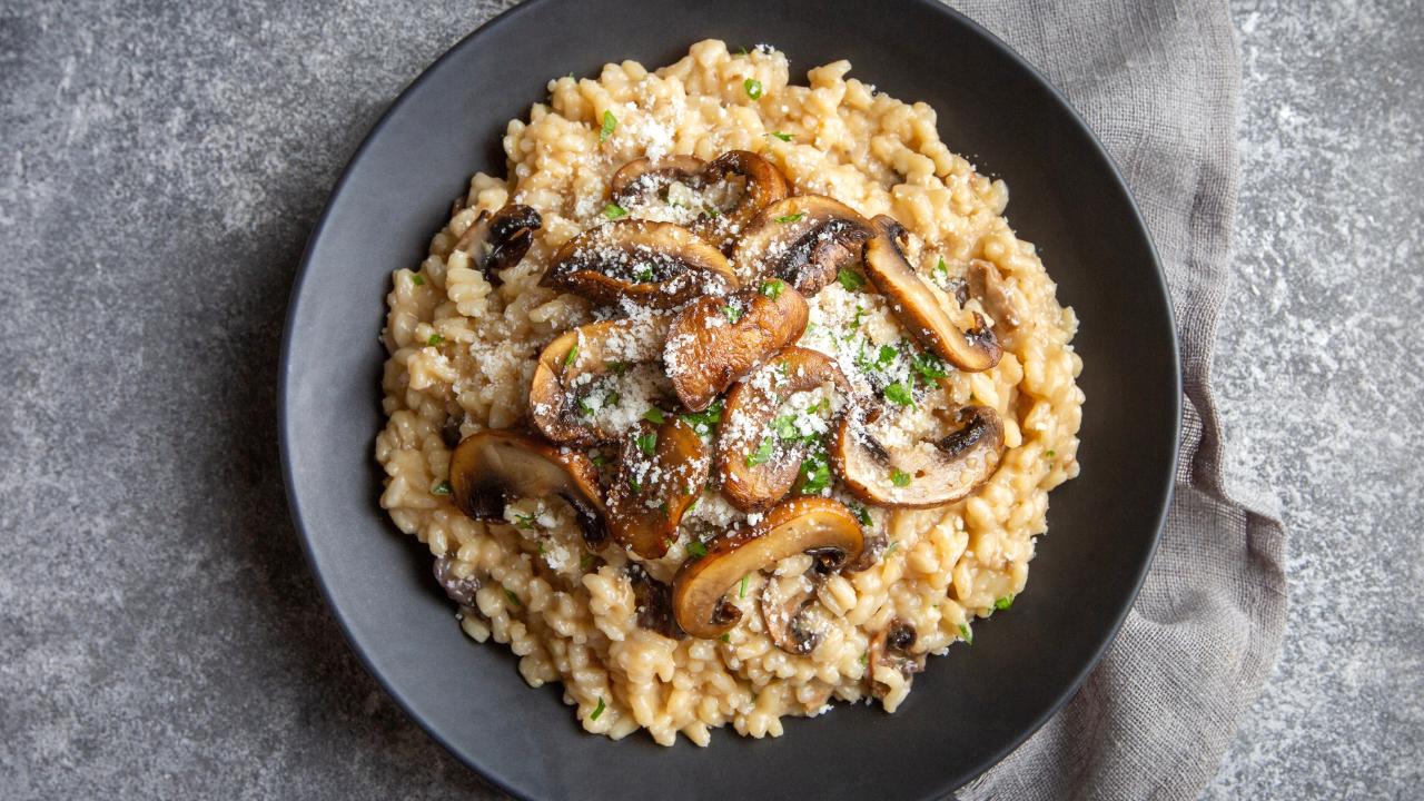 11. Creamy risotto with mushrooms, cauliflower, leeks, and salted almonds
