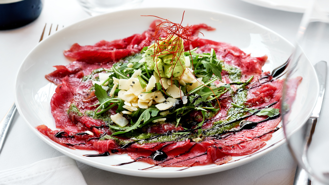6. Carpaccio with avocado, Parmesan, and pine nuts